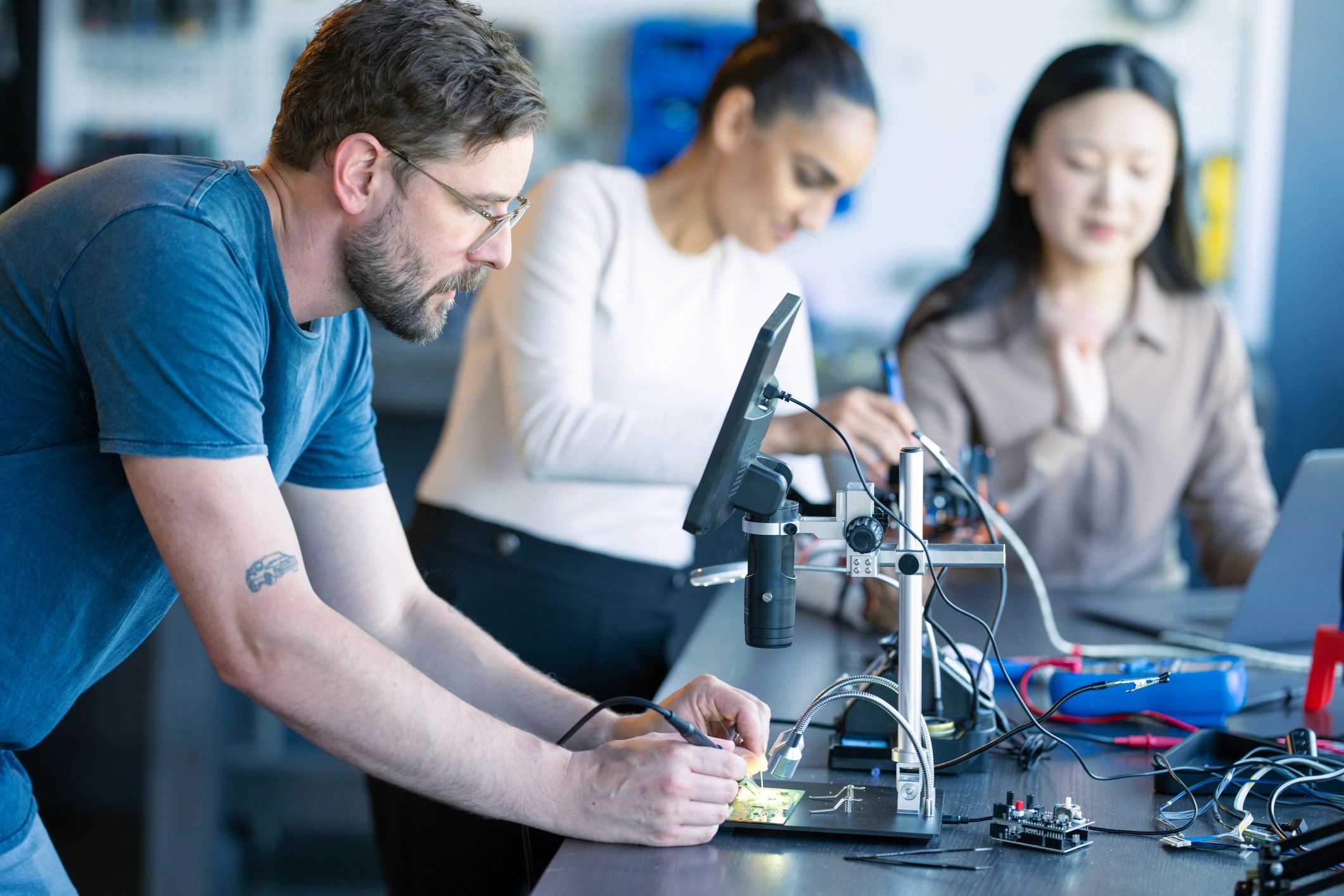 diverse electronics repair team